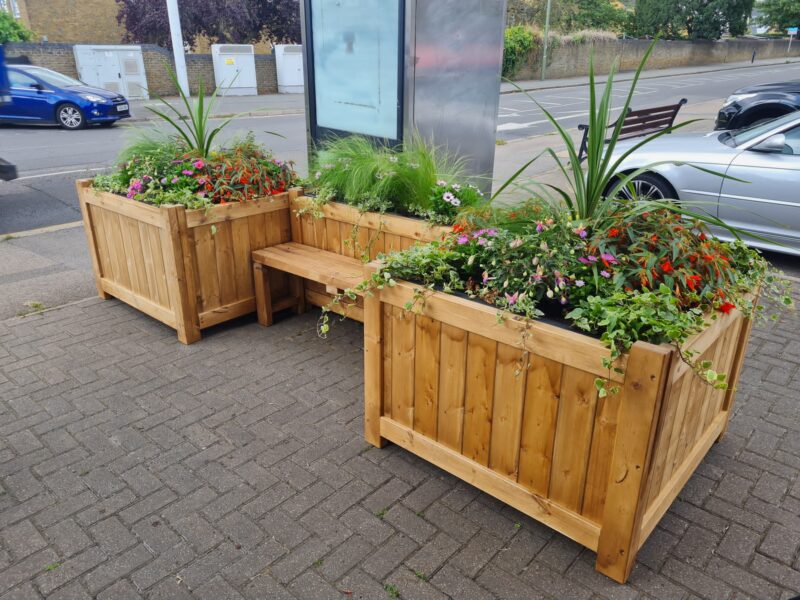 wooden bench with planters